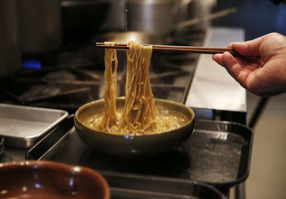 In this photo taken in April 2019, chef Justin Holt loosens noodles as he perfects the Salaryman menu. The restaurant opened in September 2019.