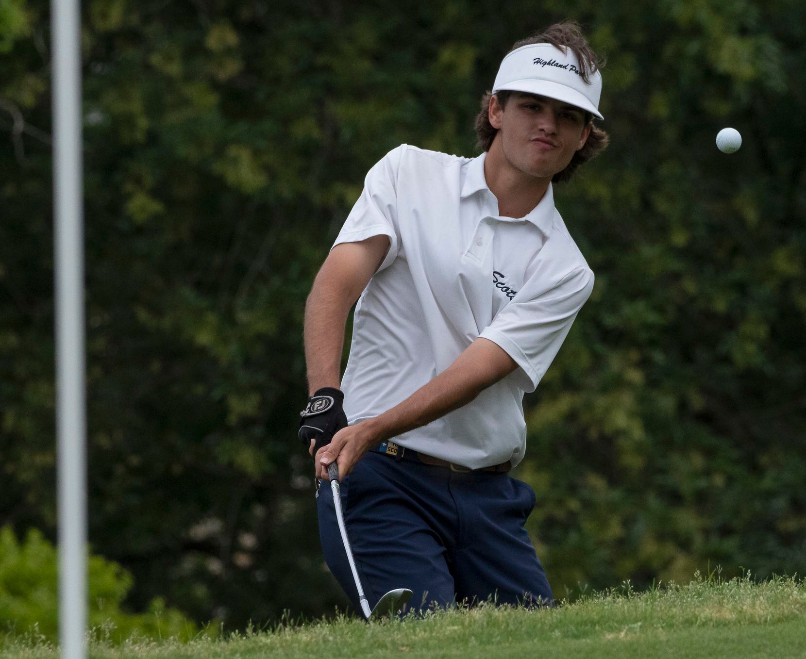 Highland Park gold, Mack Duvall, chips up on the no. 2 green during the final round of UIL...