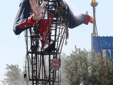 Dallas firefighters put out the last hot spots after Big Tex caught fire at the State Fair...