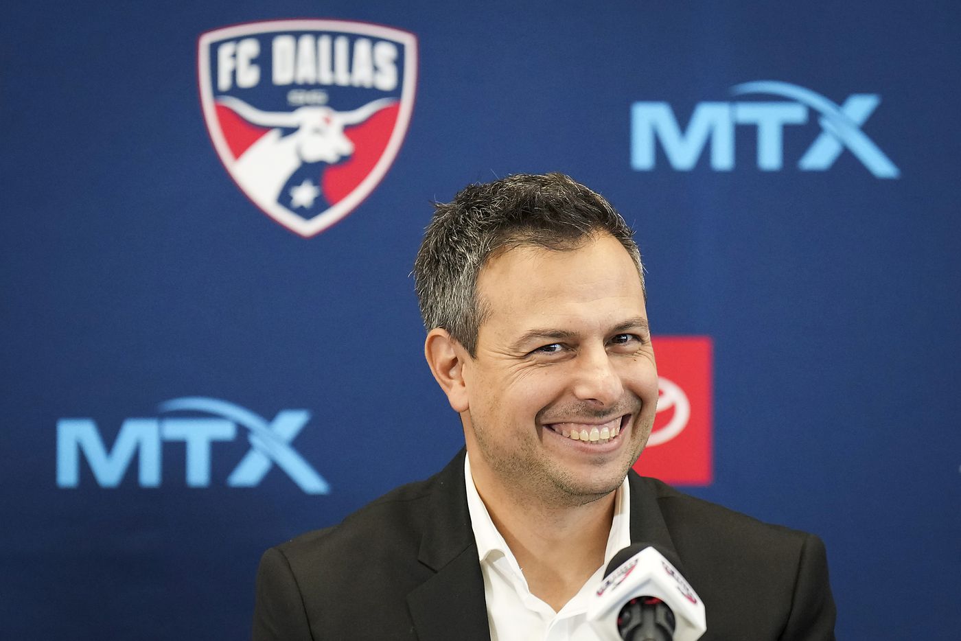New FC Dallas head coach Nico Estévez smiles during his introductory press conference at the National Soccer Hall of Fame on Friday, Dec. 3, 2021, in Frisco, Texas.