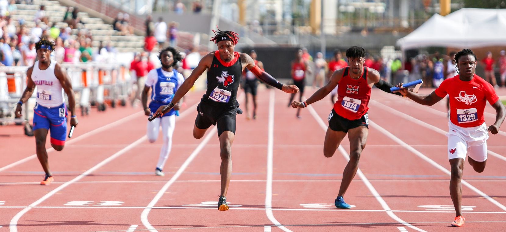 Dacorey Ware of Cedar Hill crosses the finish line in first place the 6A Boys 4x100 meter...