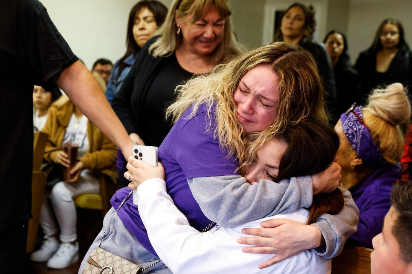 Cathleen Rodriguez, left, cousin of late Gabriel Zamora, 14, embraces Zamora’s mother Martha...