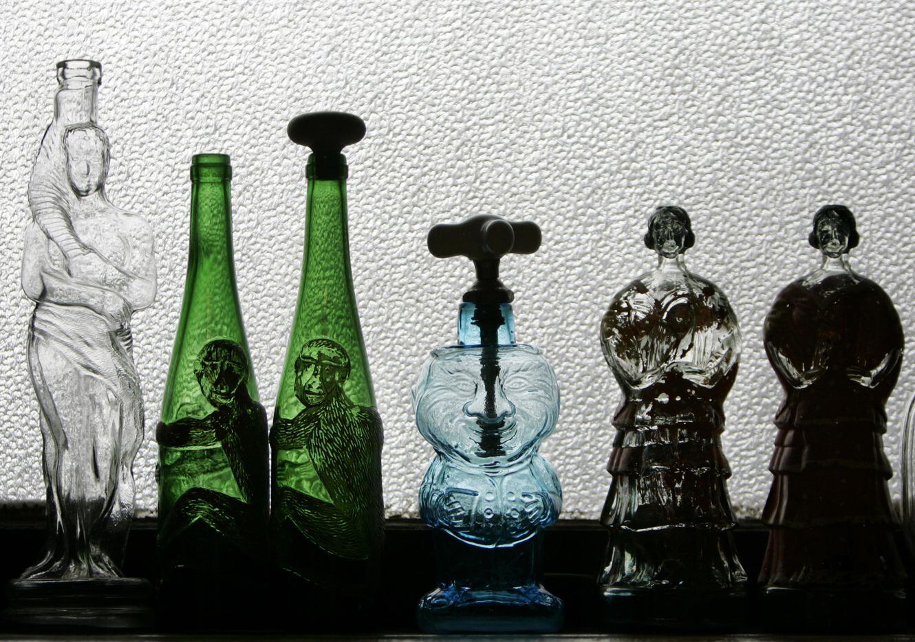 An eclectic collection of bottles lined the window in the kitchen of actress Ronnie Claire...