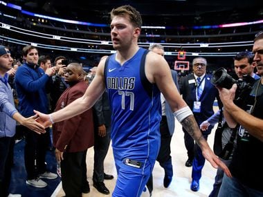 Dallas Mavericks forward Luka Doncic (77) is congratulated by fans after their win over the San Antonio Spurs at the American Airlines Center in Dallas, Monday, November 18, 2019. The Mavericks won, 117-110.