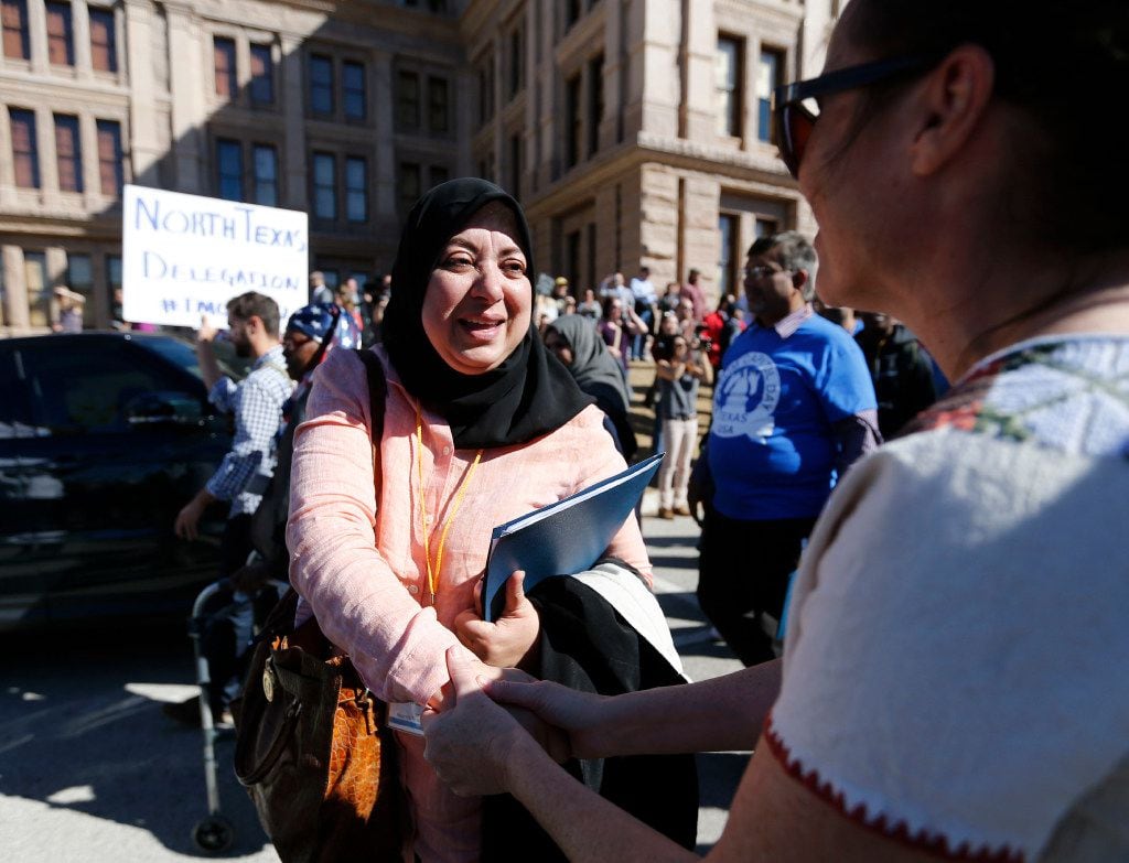 Nuzhat Hye thanks Kate Painter as she leaves the press conference at the Texas Capitol...
