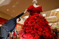 Alexander Botello of Twelve Thirty Four Studio creates a flower dress for a mannequin with...