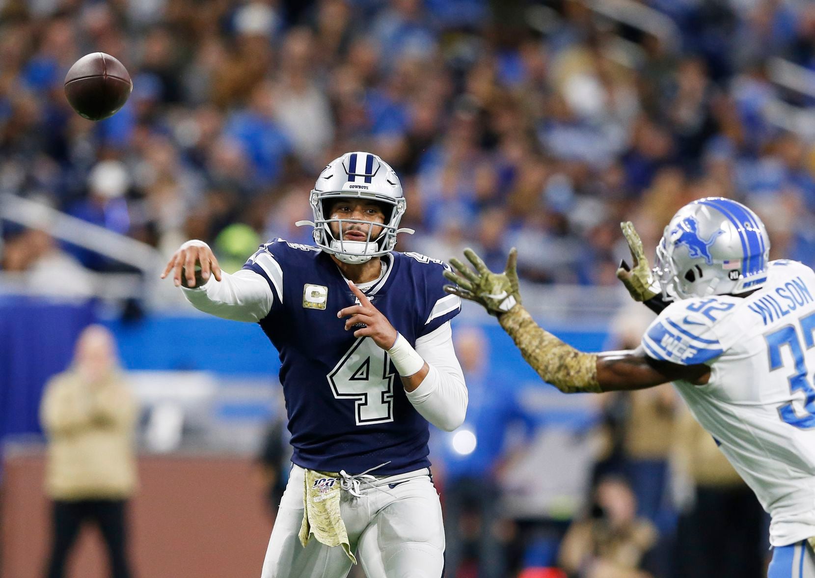 FILE - Cowboys quarterback Dak Prescott (4) attempts a pass as Lions safety Tavon Wilson...