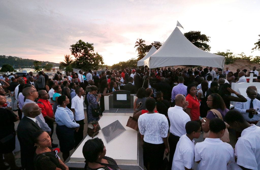 Family, friends, and locals came to the burial of Botham Shem Jean at Choc Cemetery in...