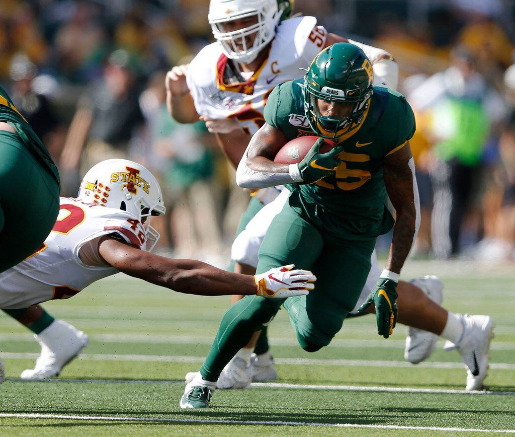 FILE - Baylor running back Trestan Ebner (25) rushes up the field as Iowa State linebacker Marcel Spears Jr. (42) attempts to tackle him during the first half of play at McLane Stadium in Waco on Saturday, Sept. 28, 2019.