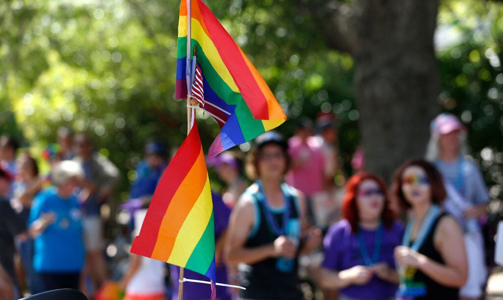 File photo of an American and rainbow flags during Dallas Gay Pride.