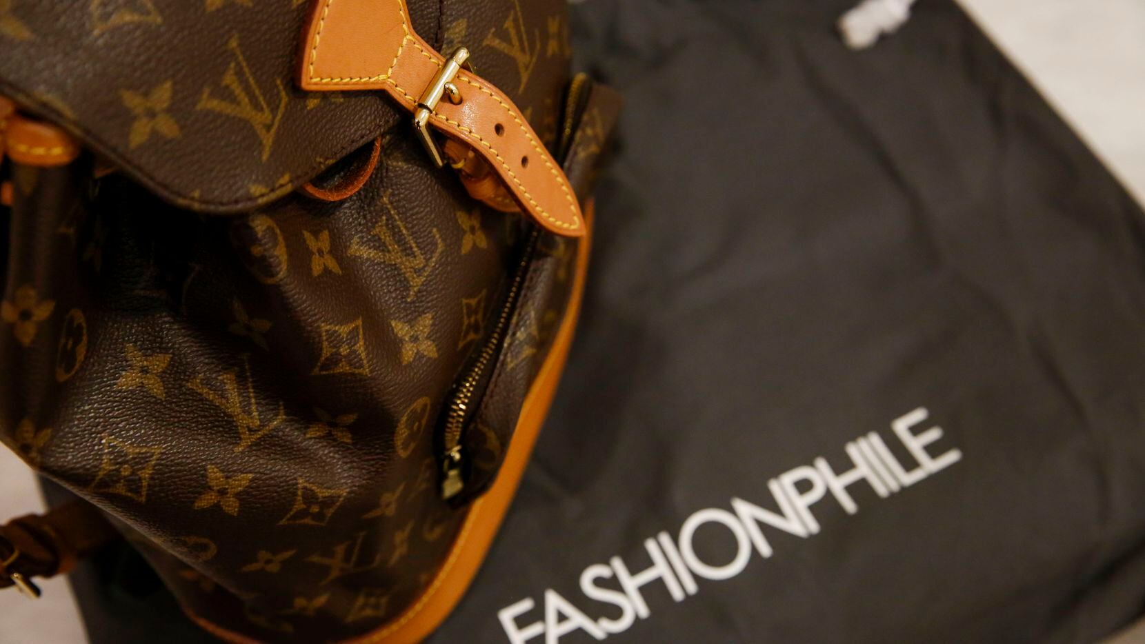 A Louis Vuitton handbag at Fashionphile inside Neiman Marcus at North Park Center sells...