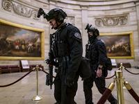 Members of the U.S. Secret Service Counter Assault Team walked through the Capitol Rotunda...