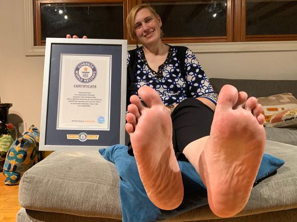 Tanya Herbert has earned a Guinness World Record for the size of her feet, breaking the...