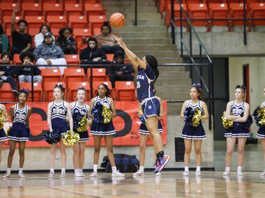 Little Elm sophomore point guard Shiloh Kimpson (20) jumps to take a three-point shot in the...