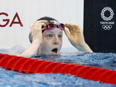 USA’s Lydia Jacoby reacts after noticing she won in the women’s 100 meter breaststroke final during the postponed 2020 Tokyo Olympics at the Tokyo Aquatics Center on Monday, July 26, 2021, in Tokyo, Japan. Jacoby won with a time of 1:04.95 to take gold.