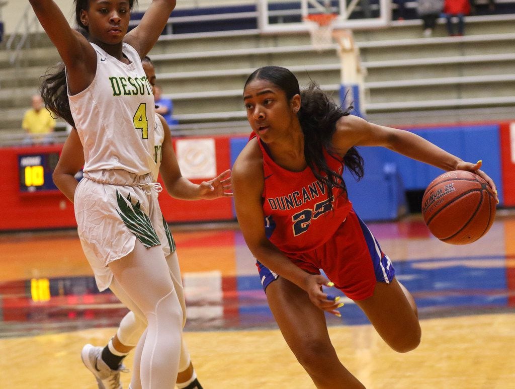 North Carolina signee Deja Kelly (25) of Duncanville drives the ball during a 66-47 victory...