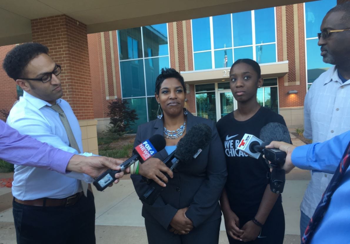 Dajerria Becton (right center) and her attorney, Kim T. Cole, at a news conference June 6 at...