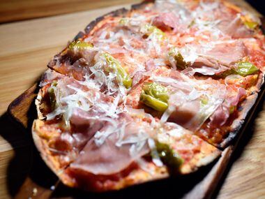 Sprezza's pizza with prosciutto, tomato, shishitos, caciocavallo and garlic