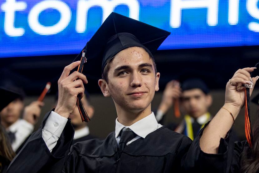 Koregan Quintanilla moved his tassel to the other side of his cap during his graduation from...