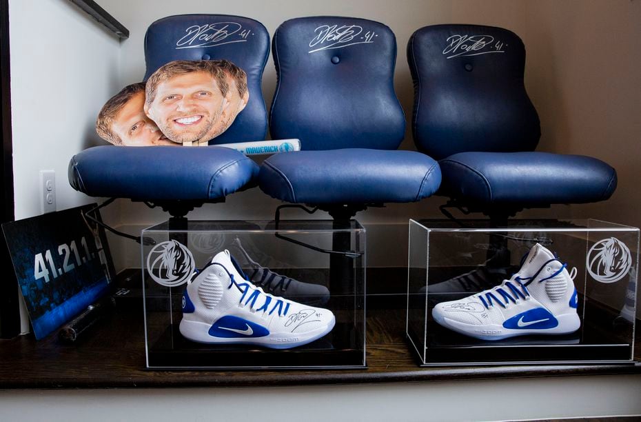 Mavericks super fan Mark Thompson's, owner of Smith-Thompson security company, Mavs' bench chairs from the 2011 season and with other memorabilia at his home on Wednesday, June 9, 2021, in Fairview. 