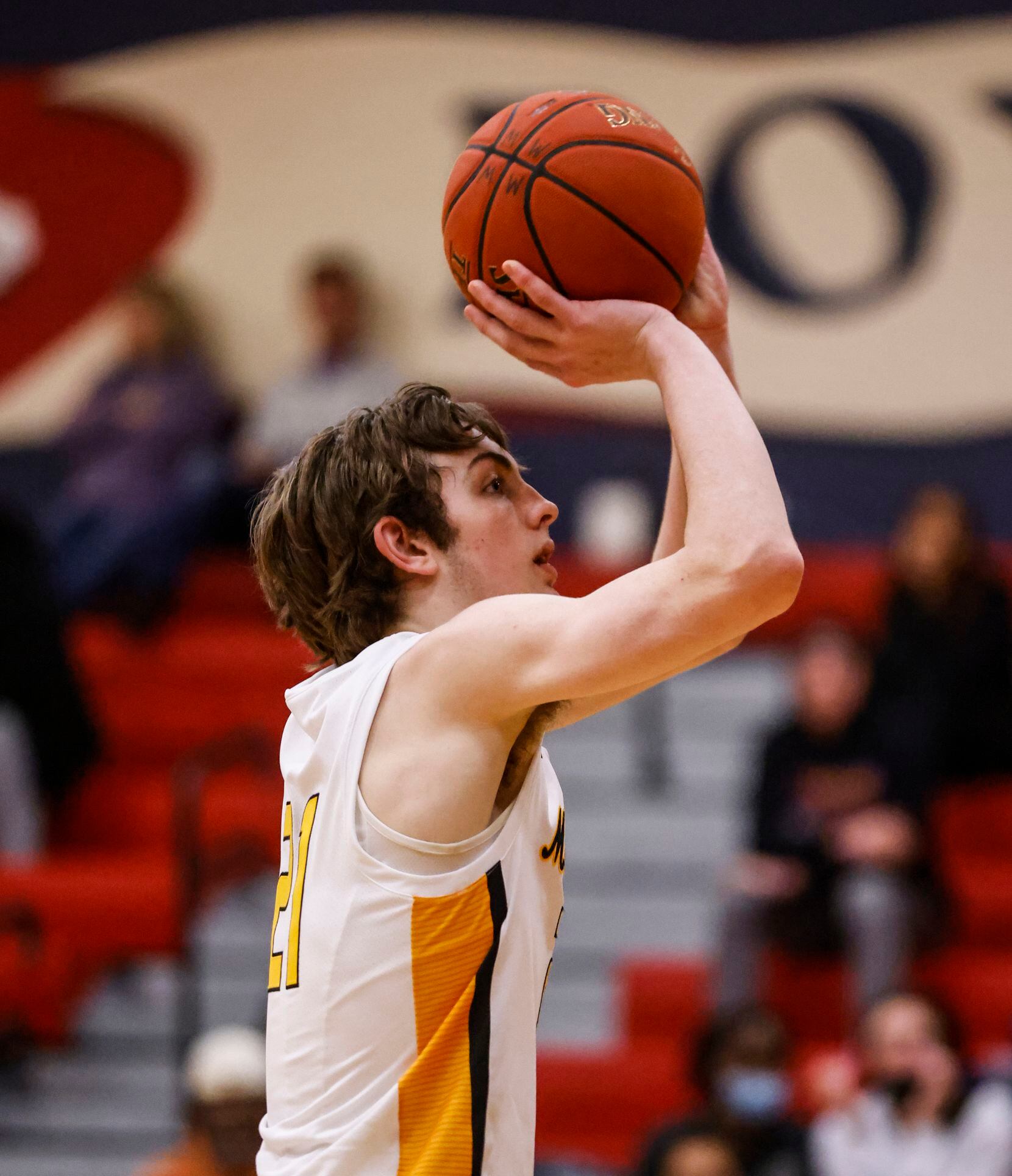Memorial High School Drew Steffe (21) shoots a free-throw in the fourth quarter at McKinney...