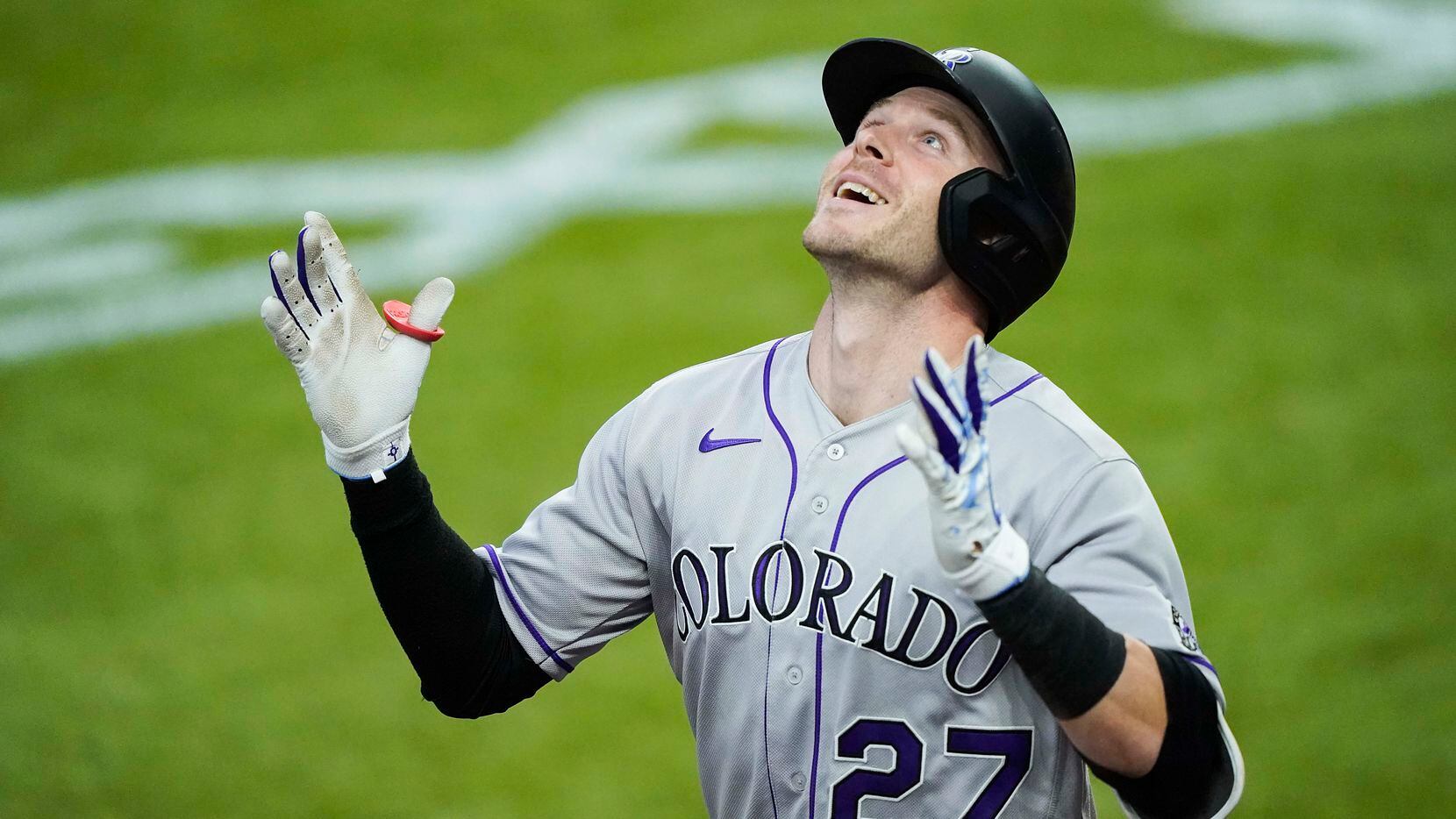 Colorado Rockies shortstop Trevor Story celebrates after hitting a 2-run home run during the...