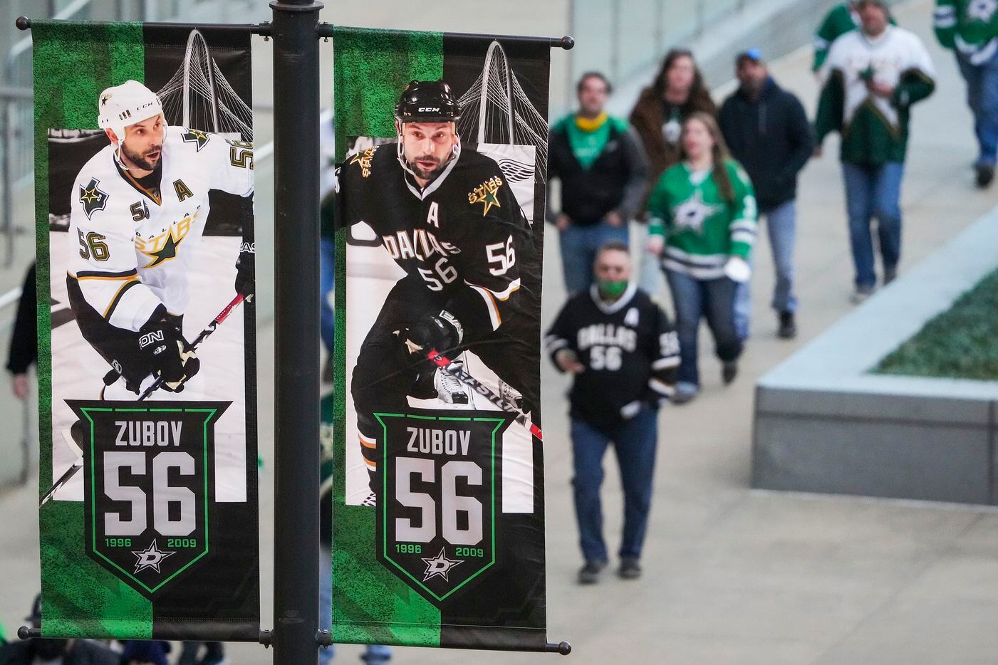Banners honoring former Dallas Stars player Sergei Zubov are seen outside the arena as fans...