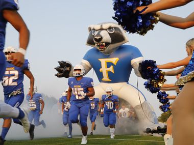 The Frisco High School football team takes the field as Frisco High School hosted Lake Dallas High School at Kuykendall Stadium in Frisco on Friday evening, September 10, 2021. (Stewart F. House/Special Contributor)