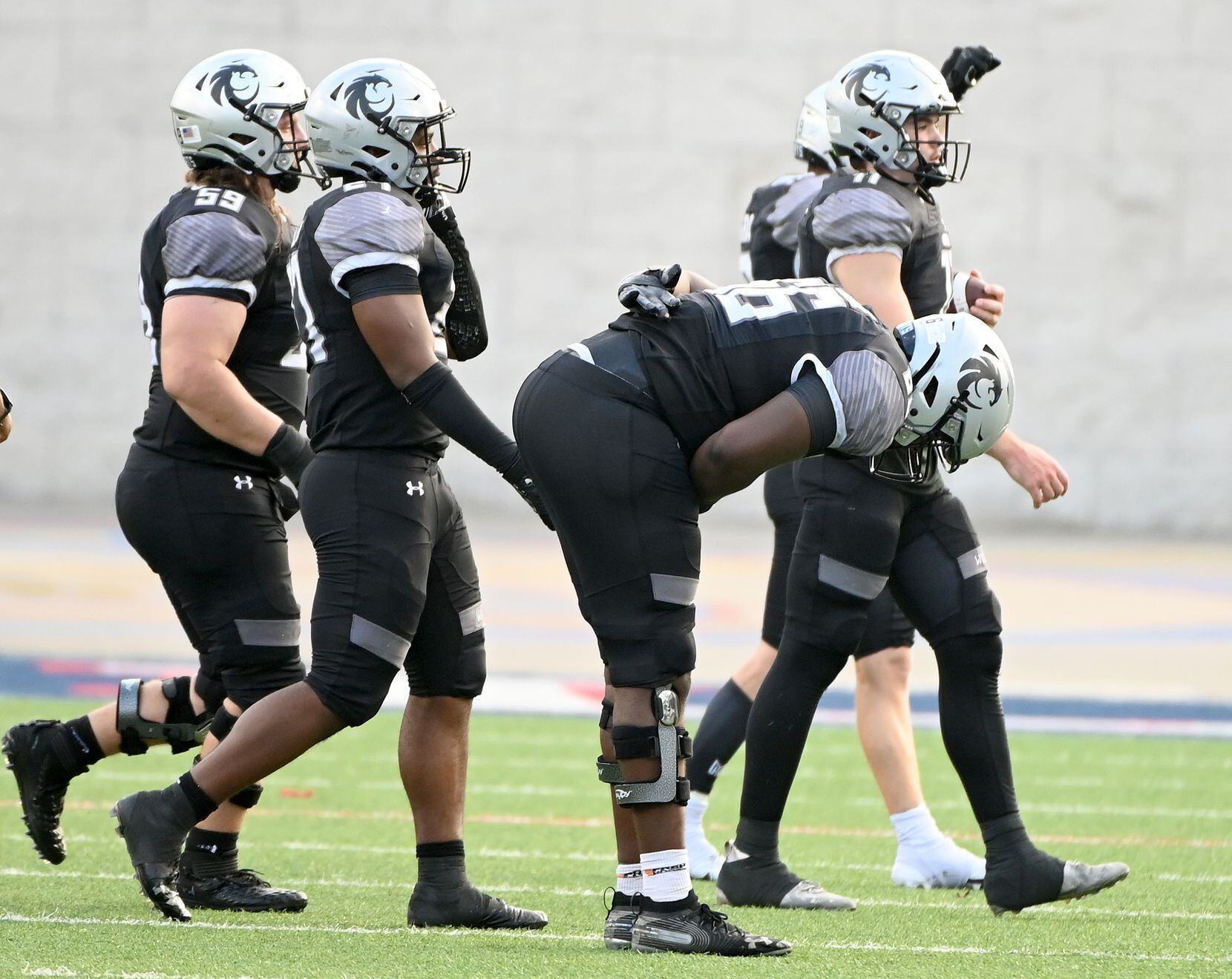 Denton Guyer's Willie Goodacre (66) takes a bow as he walks off the field with teammate after their 25-22 win of a Class 6A Division II Region I final high school playoff football game between Denton Guyer and Prosper, Saturday, Dec. 4, 2021, in Allen, Texas. (Matt Strasen/Special Contributor)