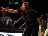 North Texas coach Jalie Mitchell works from the sideline during a Women’s Basketball...