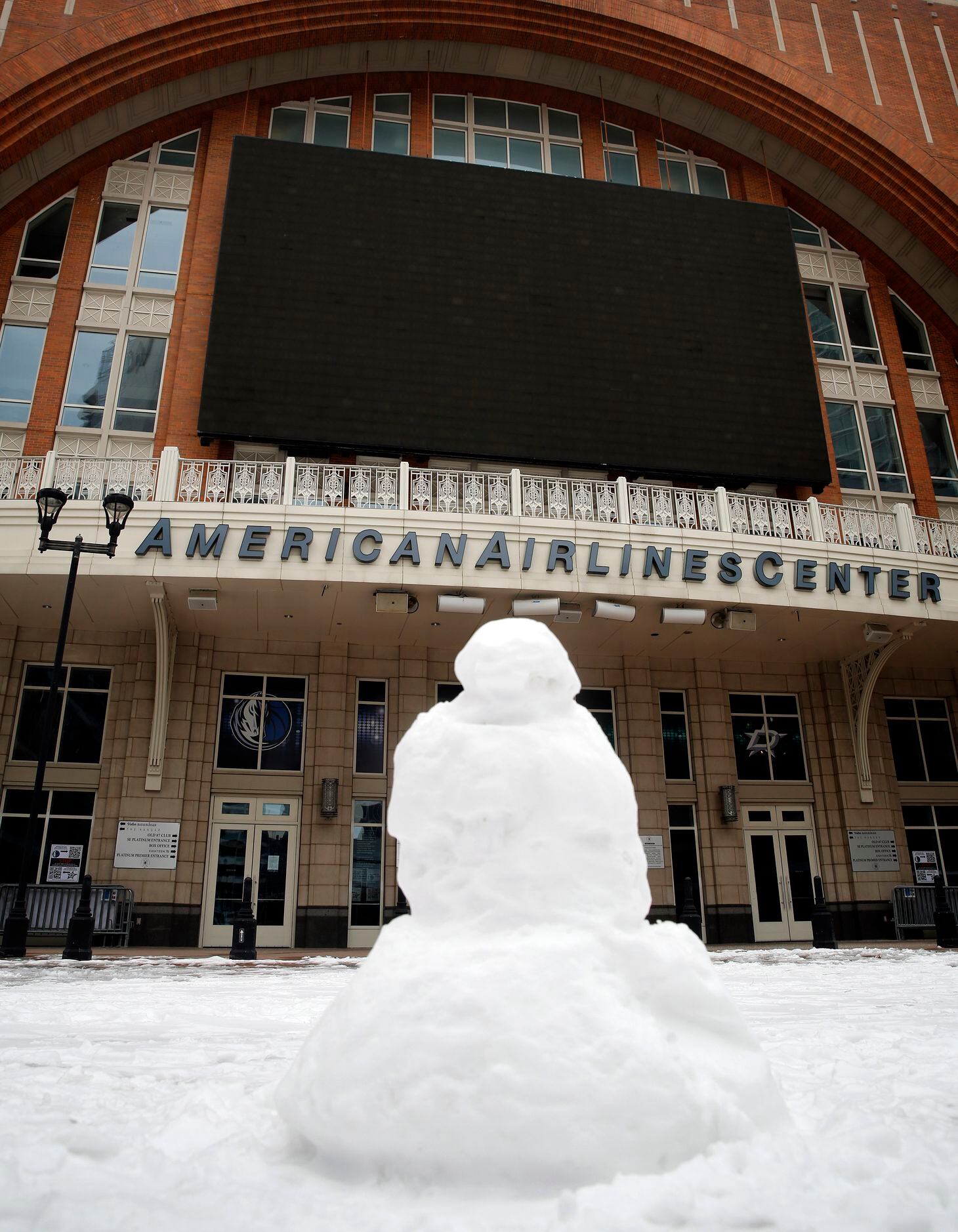 Someone built a snowman on Victory Plaza outside the American Airlines Center in Dallas, ...