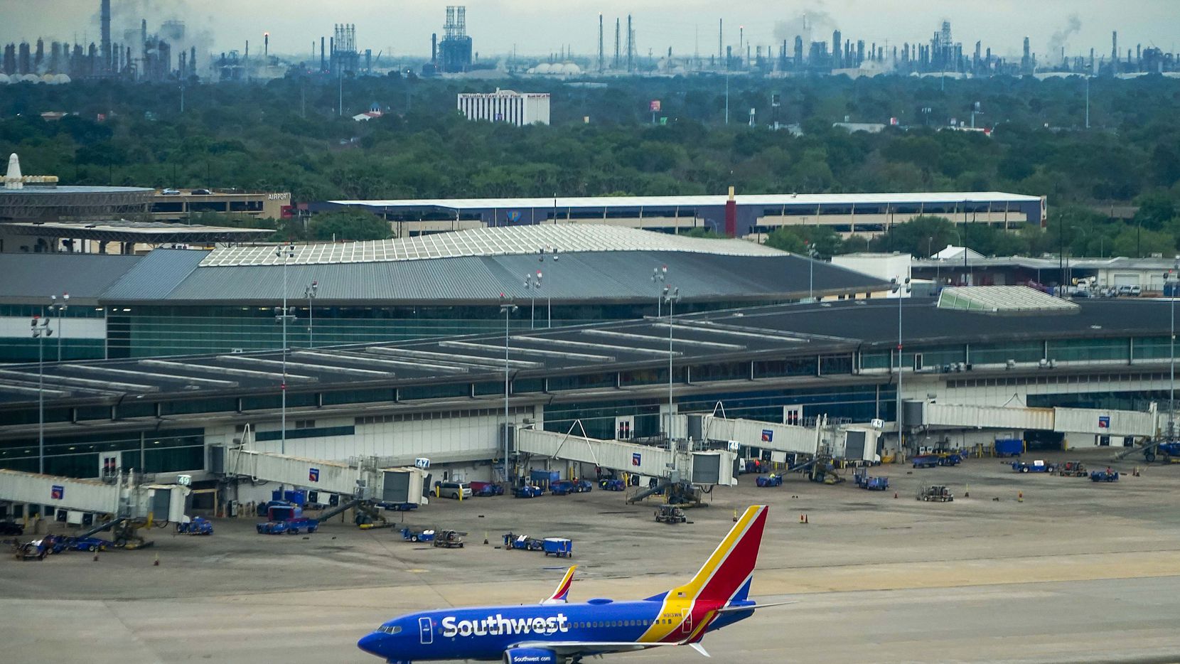 A Southwest Airlines 737-700 taxis to the terminal at Houston Hobby Airport on Friday, March...