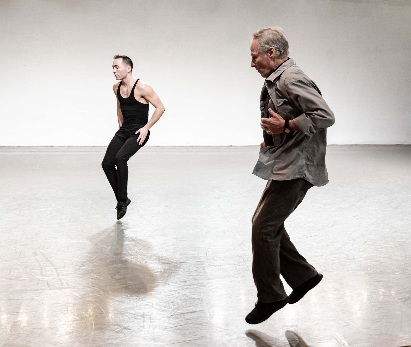 The 78-year-old choreographer Lar Lubovitch (right) gets airborne as he coaches Bruce Wood...