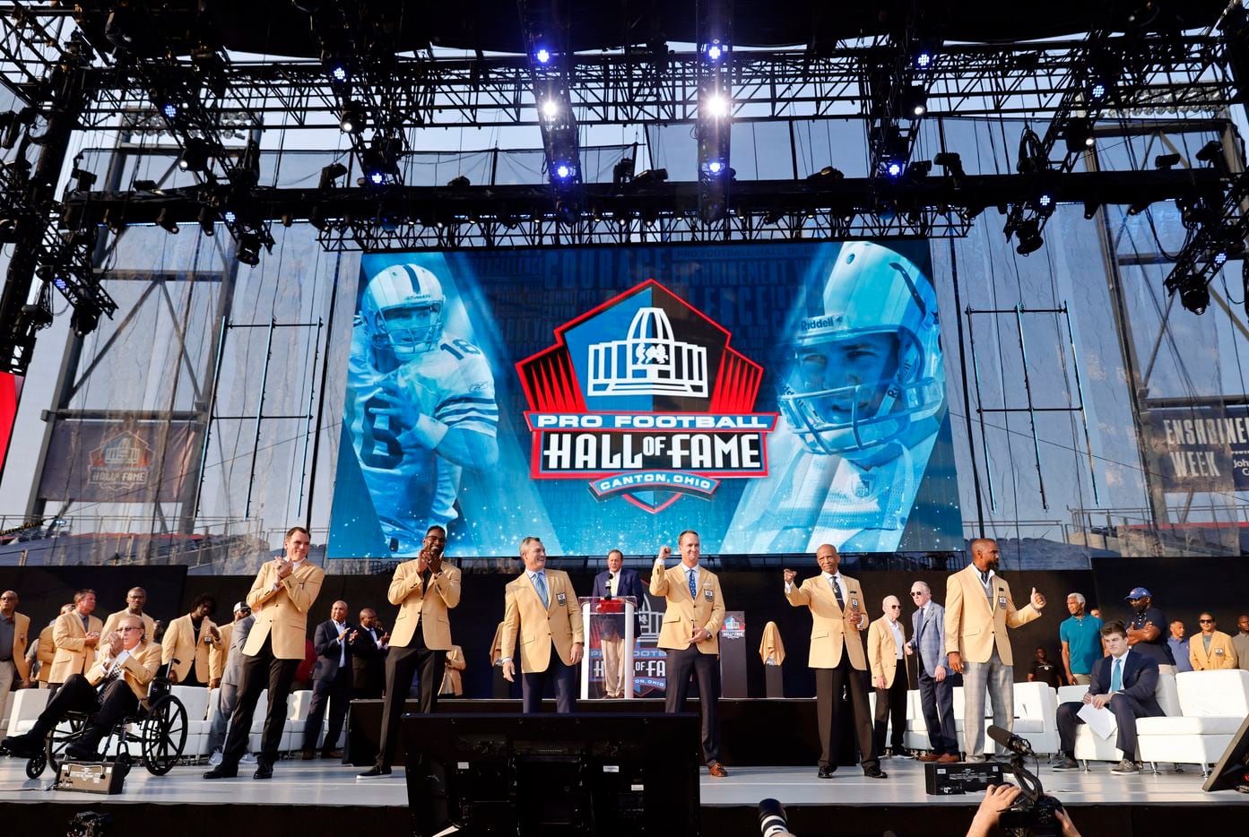 Pro Football Hall of Fame inductees, including Drew Pearson of the Dallas Cowboys (second from right) pose onstage after being introduced  during the Class of 2021 enshrinement ceremony at Tom Benson Hall of Fame Stadium in Canton, Ohio, Sunday, August 8, 2021. (Tom Fox/The Dallas Morning News)
