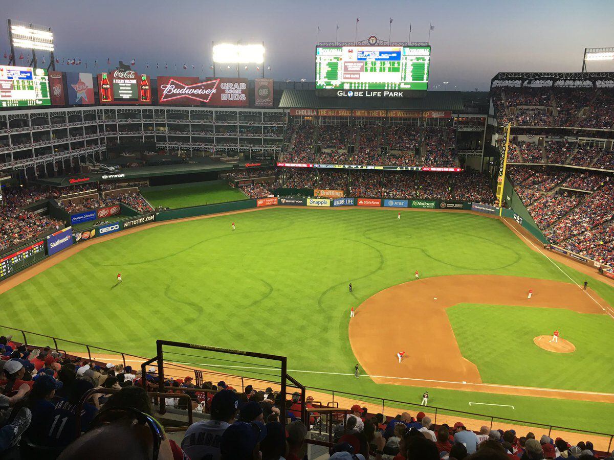 Outlines where the Rangers grounds crew had to resod before the season are obvious during a...