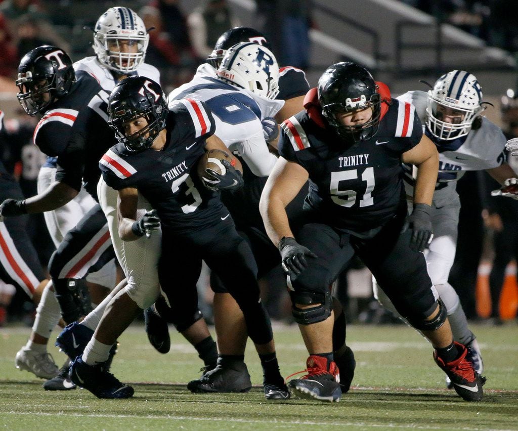 Euless Trinity's Lotu Asaeli (51) blocks for Zechariah Moore (3) as they played Richland...