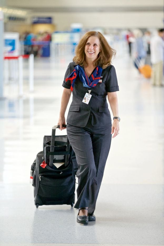 American Airlines Flight Attendant Diane Huisenga, wearing one of the airline's new...