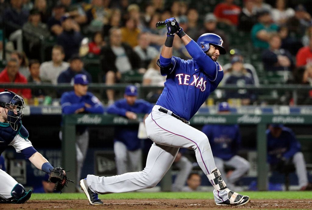 Texas Rangers' Nomar Mazara strikes out swinging with the bases loaded to end the top of the...