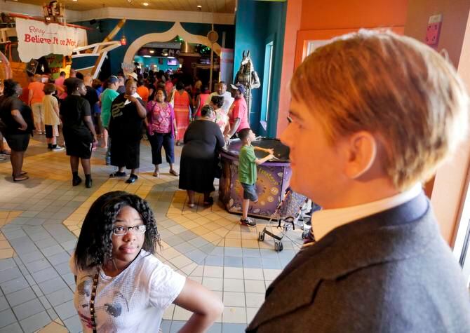 
Macari Ellington of Fort Worth looked up at a wax figure of Leonardo DiCaprio, one of more...