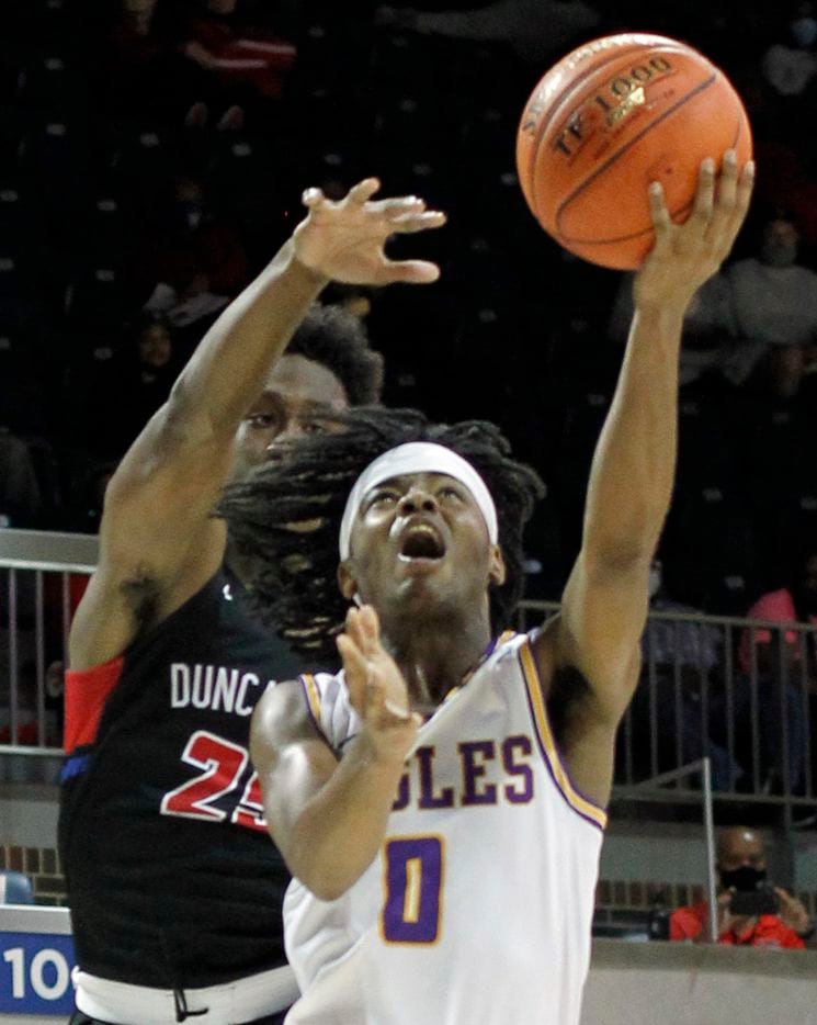 Richardson guard Jaylon Barnett (0) drives to the basket as Duncanville guard Damon Nicholas (25) defends during first half action.  The two teams played their Class 6A state semifinal boys basketball playoff game at Moody Coliseum on the campus of SMU in Dallas on March 9, 2021. (Steve Hamm/ Special Contributor)
