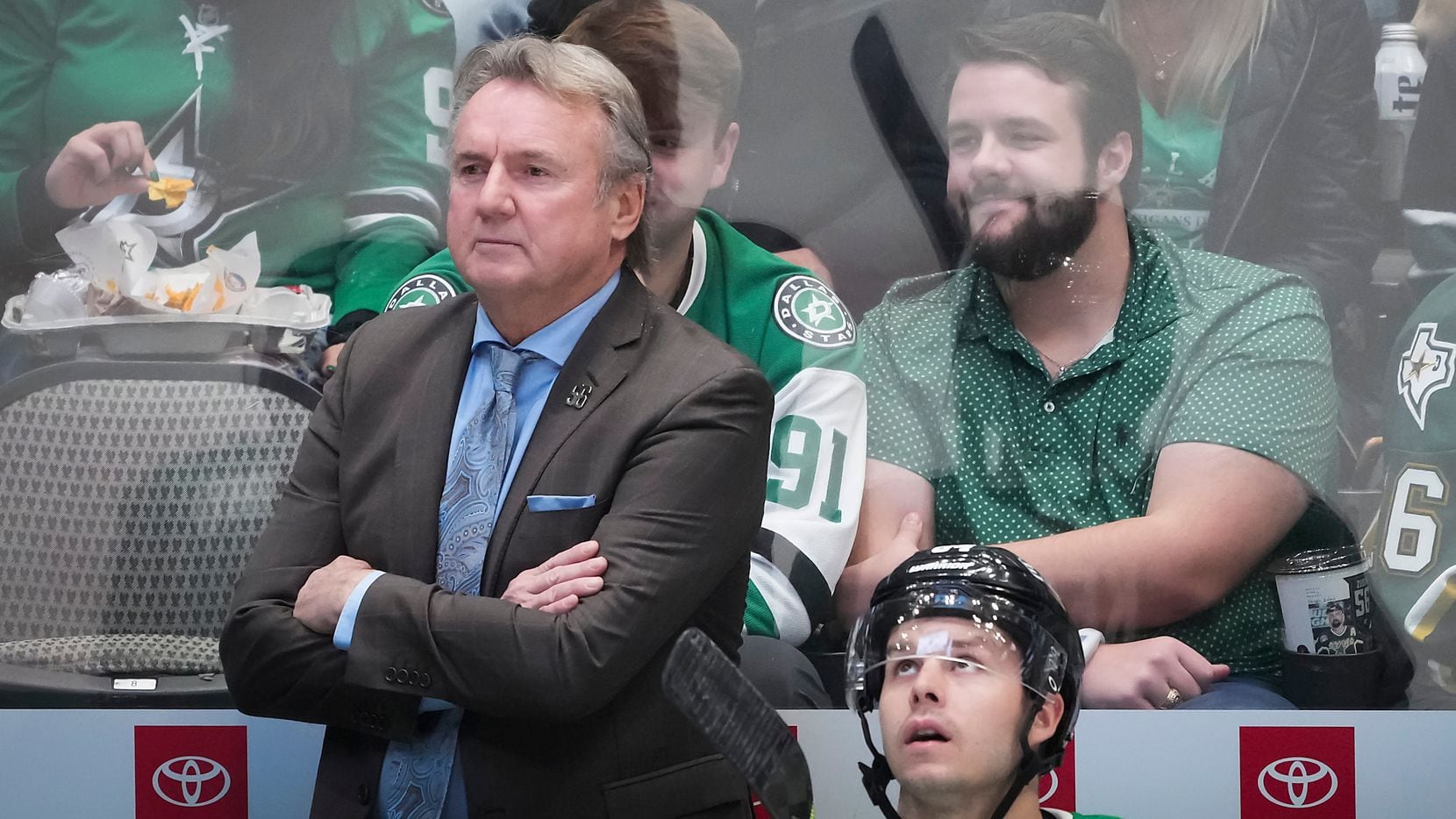 Dallas Stars coach Rick Bowness watches from the bench during the first period of an NHL...