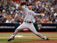Pitcher Cliff Lee #33 of the Texas Rangers pitches against the Tampa Bay Rays during Game 1...