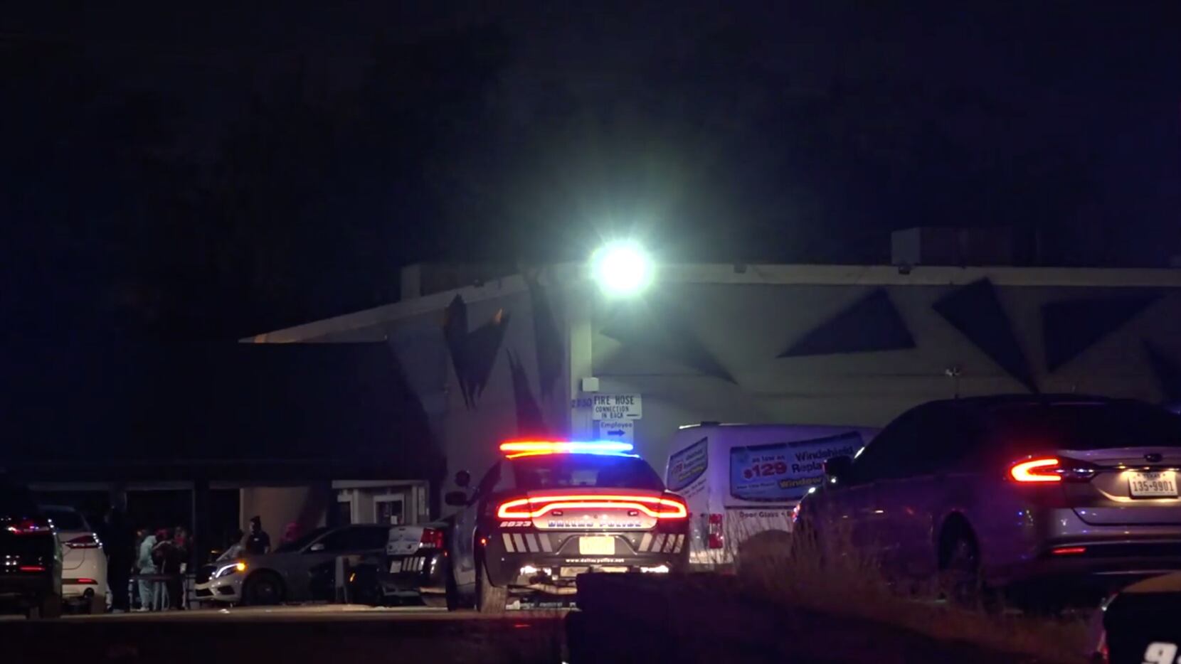 Police at the scene of a shooting that left three dead in northwest Dallas early Sunday,...