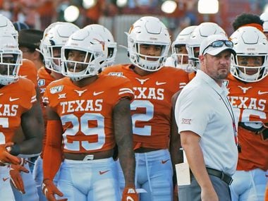 Texas head coach Tom Herman waits with his team before the start of an NCAA college football game against Oklahoma State, Saturday, Sept. 21, 2019, in Austin, Texas. (AP Photo/Michael Thomas)