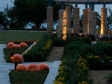 The Dallas skyline and White Rock Lake are seen from the new Tasteful Place edible garden at...
