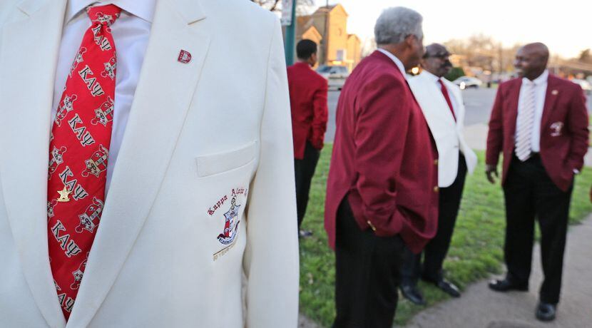 Kappa Alpha Psi 50-year member Stephen Washington displays his necktie as members gather at...