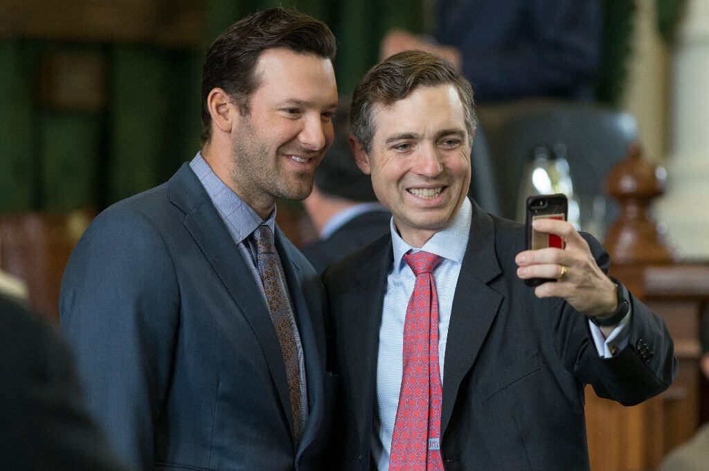 Former Dallas Cowboys quarterback Tony Romo takes a photo with Sen. Van Taylor, R-Plano, as he is recognized by the Senate at the Texas Capitol in Austin, Wednesday, May 3, 2017. 