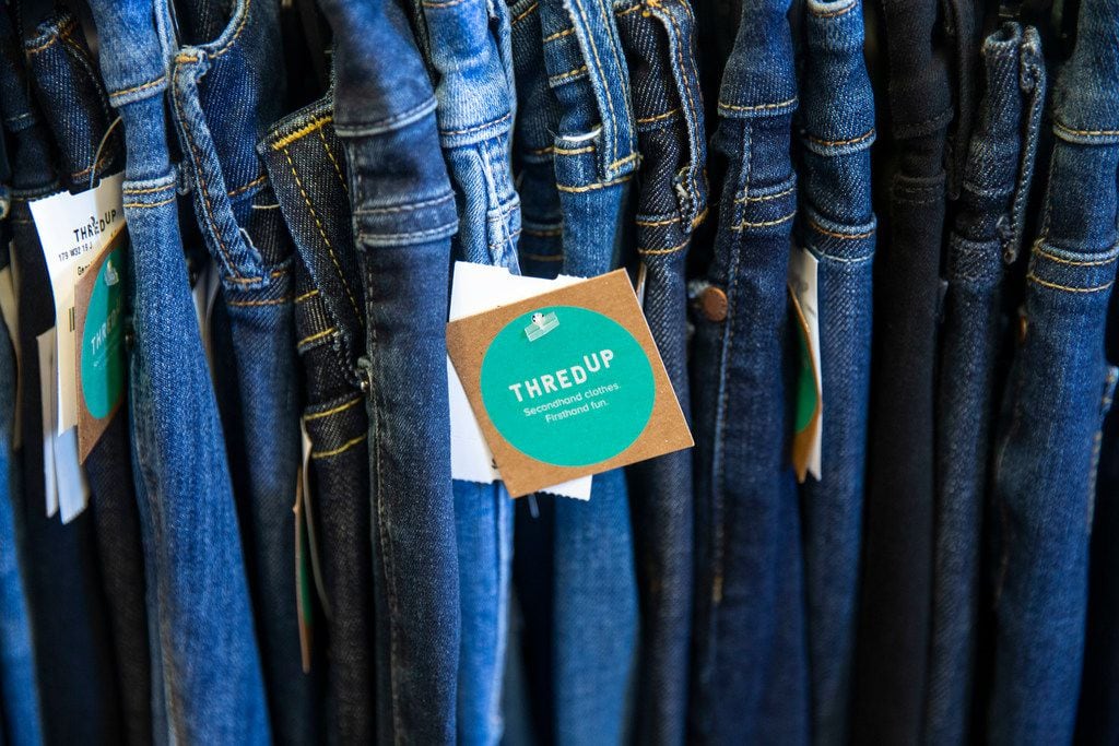 Jeans sit on the shelves in the thredUP section at J.C. Penney.