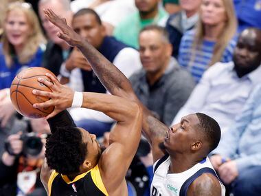 Dallas Mavericks forward Dorian Finney-Smith (10) defends Utah Jazz guard Donovan Mitchell...