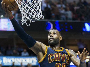 Cleveland Cavaliers forward LeBron James (23) goes up for a shot during overtime of their...